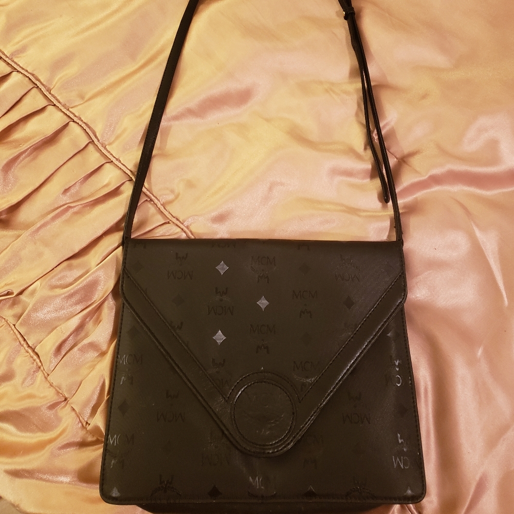 Authentic Large MCM clutch with adjustable strap